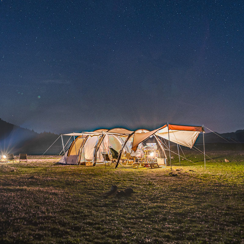 Large Tunnel Tent in use for family camping, set up with vestibule
