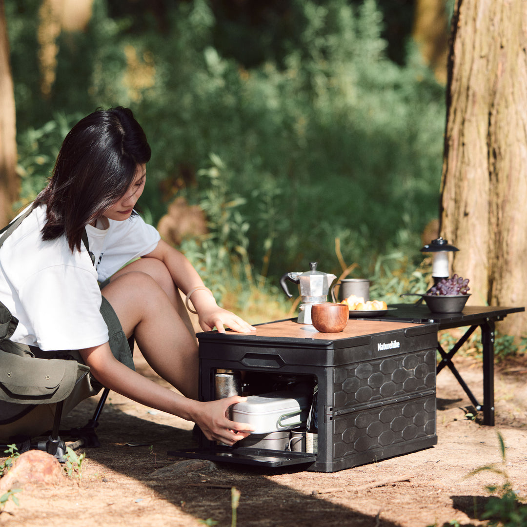 50L storage bin with camping gear inside for outdoor use