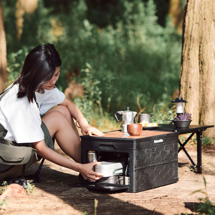 50L storage bin with camping gear inside for outdoor use