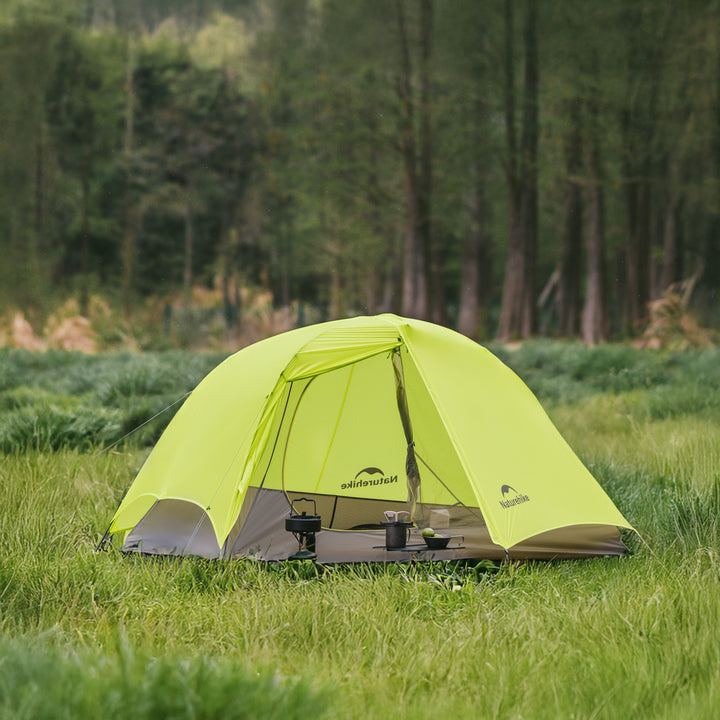 Naturehike Star Trail tent set up at a campsite, showing solo backpacking in the mountains.