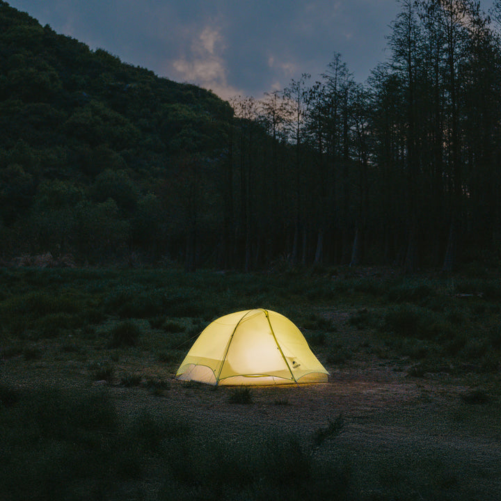 Naturehike Star Trail 1-Person Tent set up at night on a campsite, ultralight and waterproof, perfect for solo backpacking.